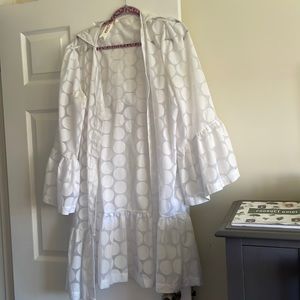 Designer made swim cover up hooded and polka dotted .